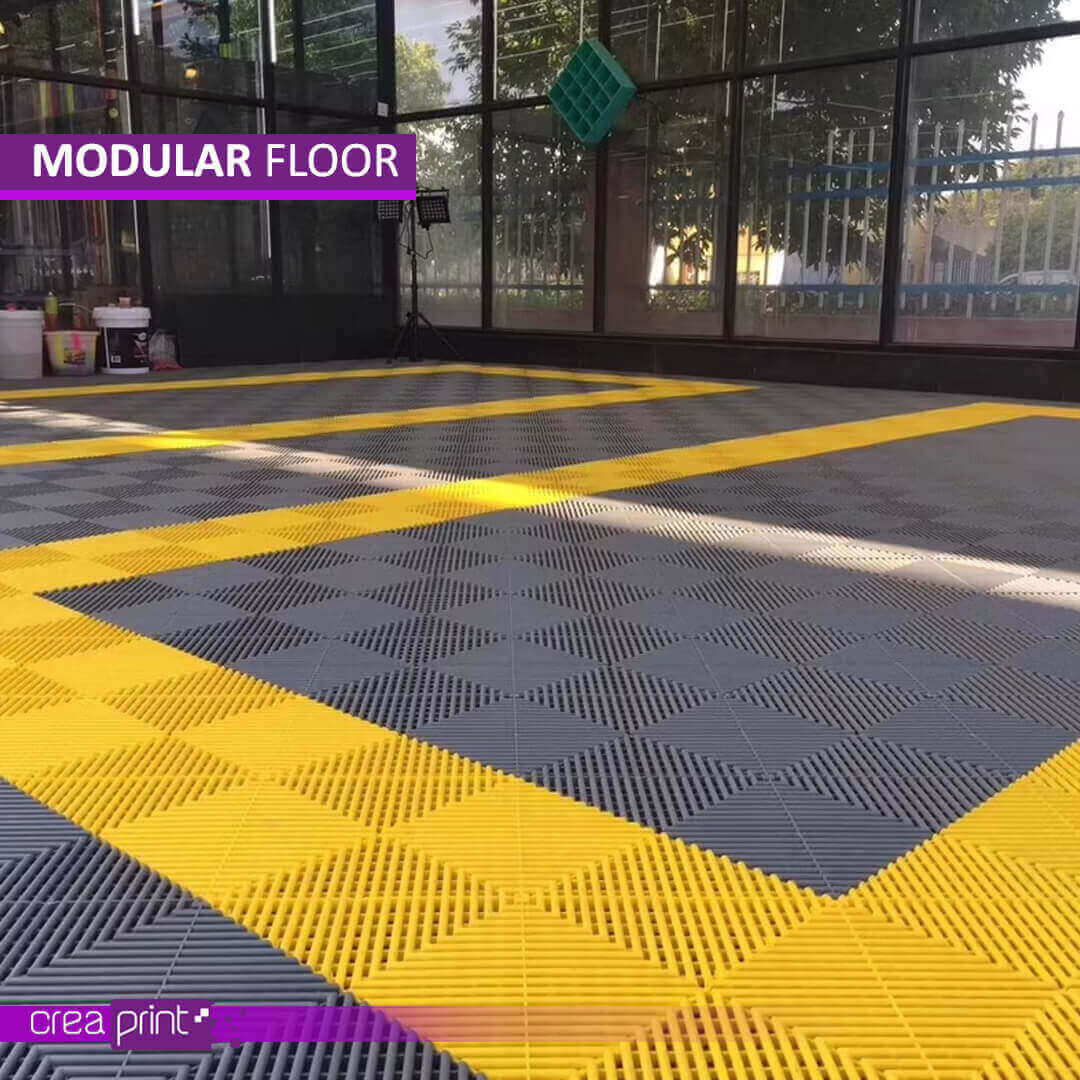 Modular interlocking floor mats made of polypropylene, offering anti-slip, drainage, and load-bearing capabilities for various commercial, industrial, and residential spaces.