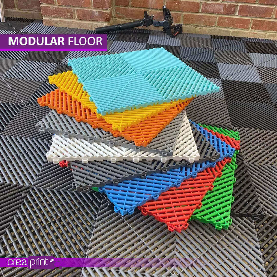 Heavy-duty modular floor mats with interlocking design, superior drainage, anti-slip properties, and customizable colors for garages, wet areas, and industrial spaces.