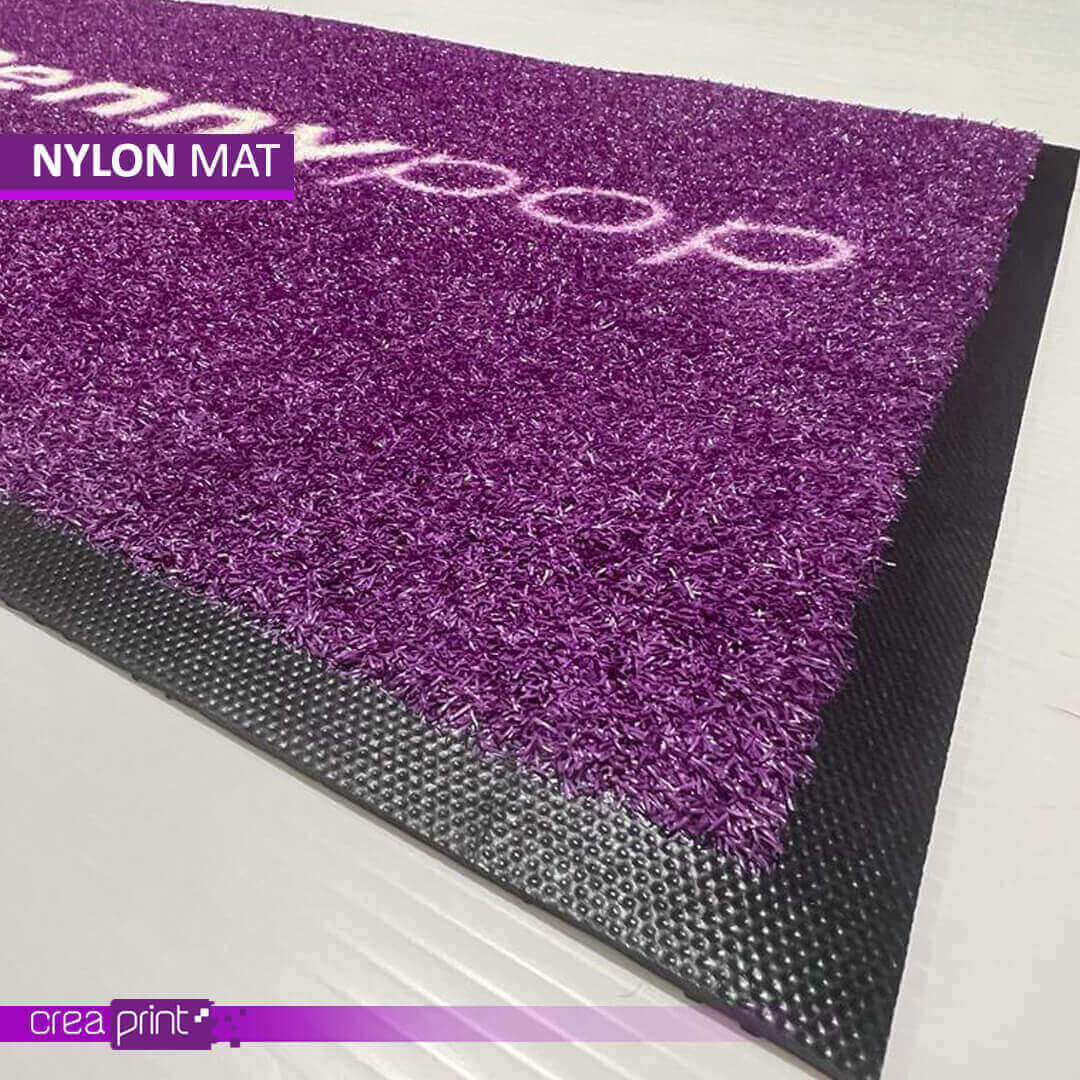 Premium nylon door mat with custom logo design for homes, offices, and commercial spaces.
