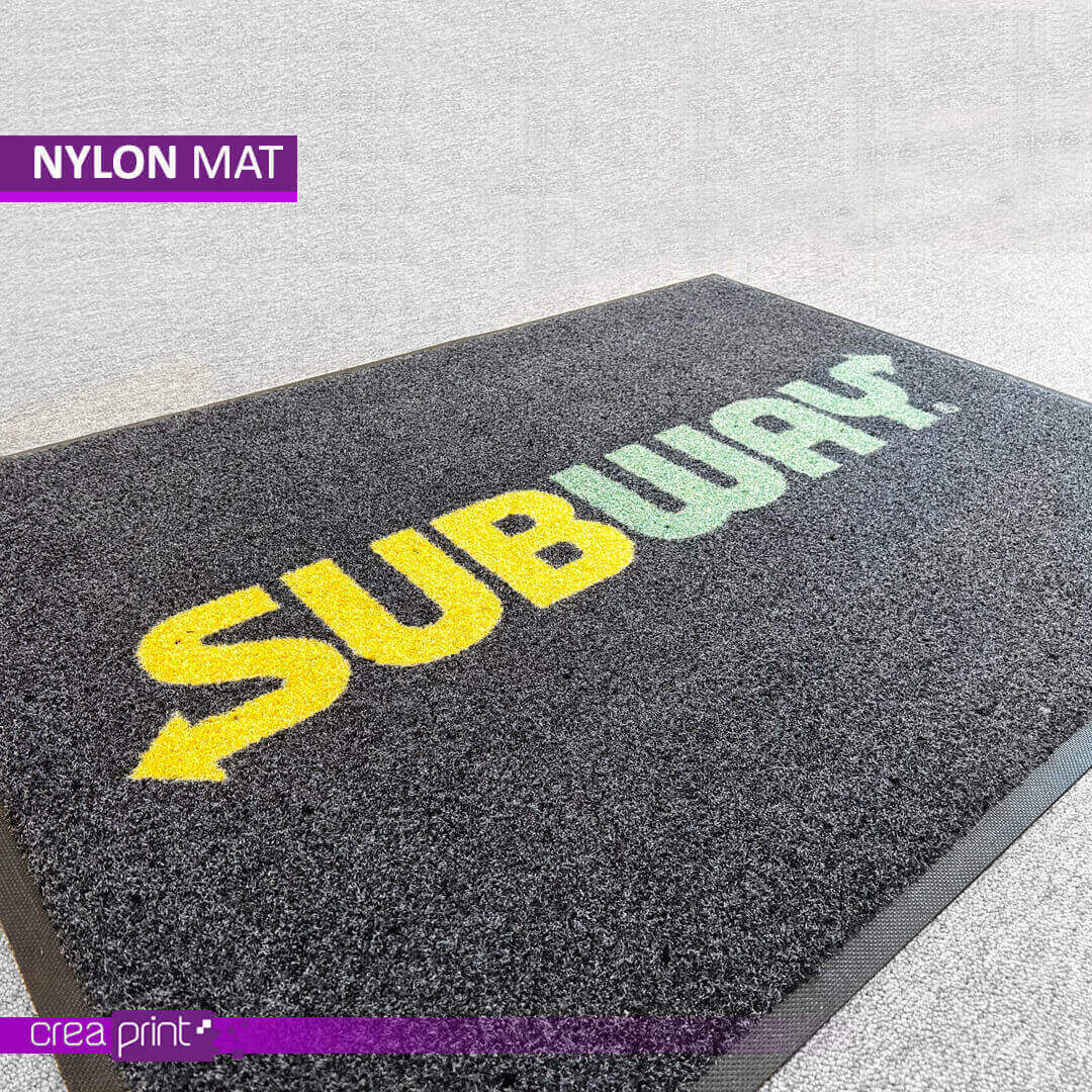 Custom nylon door mat with vibrant logo and durable design, suitable for homes and businesses.