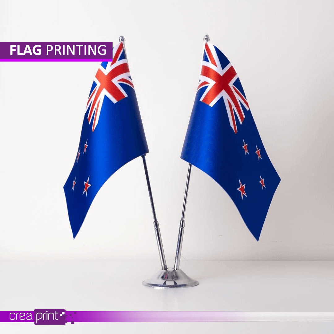 Custom-printed flags by Creaprint for events and businesses, available in various sizes and designs.