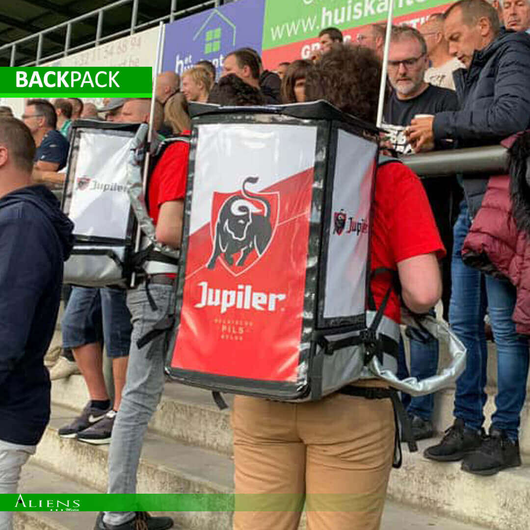Custom backpack dispenser serving cold beverages at a sports event.