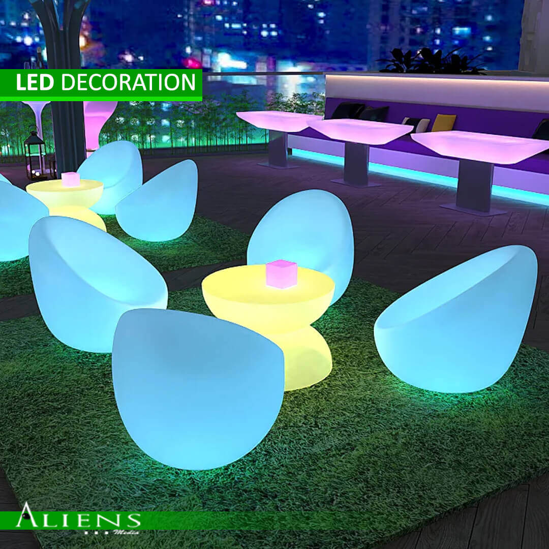 Illuminated LED furniture with customizable color settings for events.