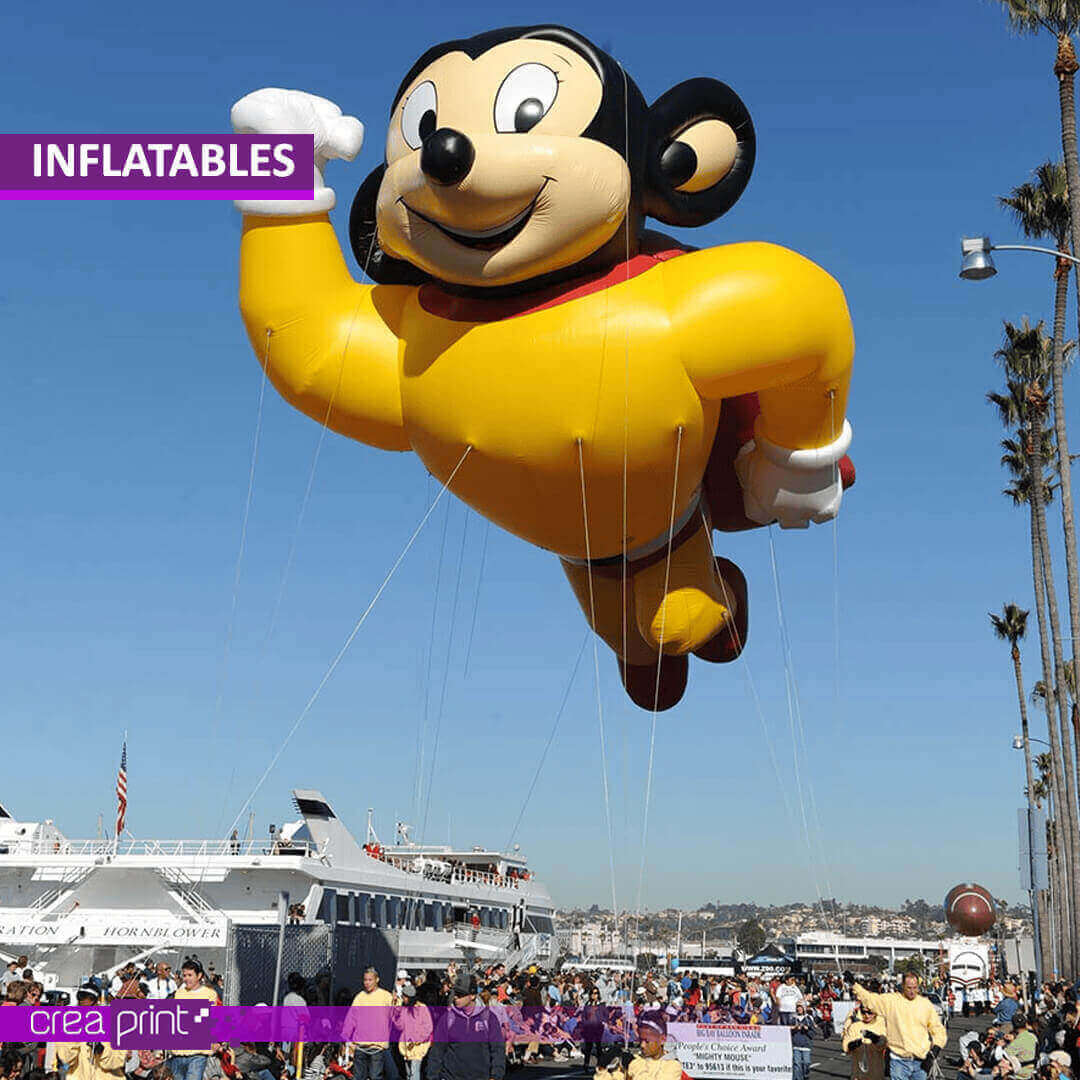 A vibrant image of a custom-designed inflatable archway at a trade show, showcasing its impressive size and eye-catching design. Attendees are drawn to the vibrant colors and engaging visuals, interacting with the inflatable.