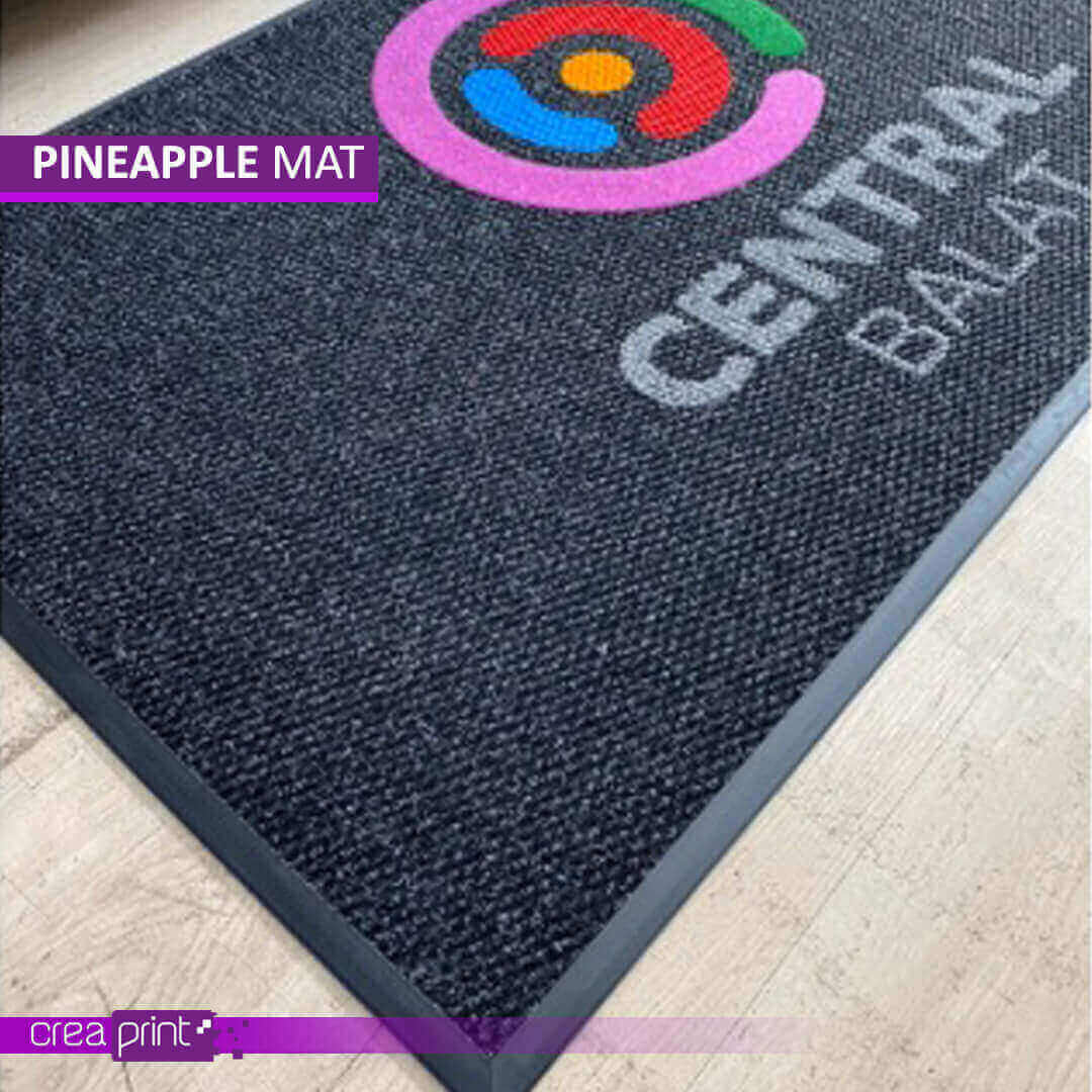 Durable Berber door mat featuring a custom pineapple logo, perfect for homes and businesses seeking a personalized and stylish entryway solution.