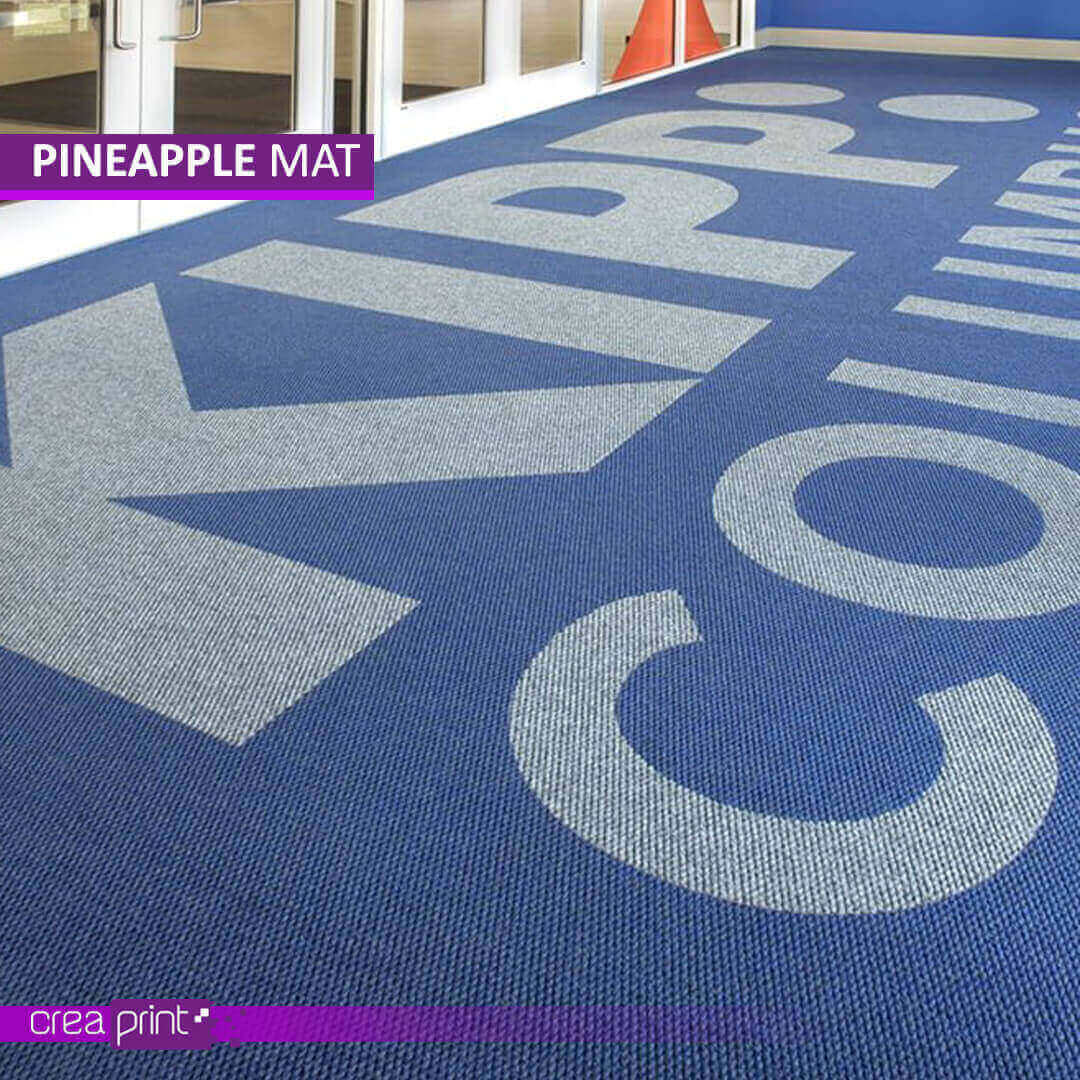 Durable custom Berber door mat featuring a pineapple logo, designed for elegance, weather resistance, and exceptional dirt trapping for homes and businesses.