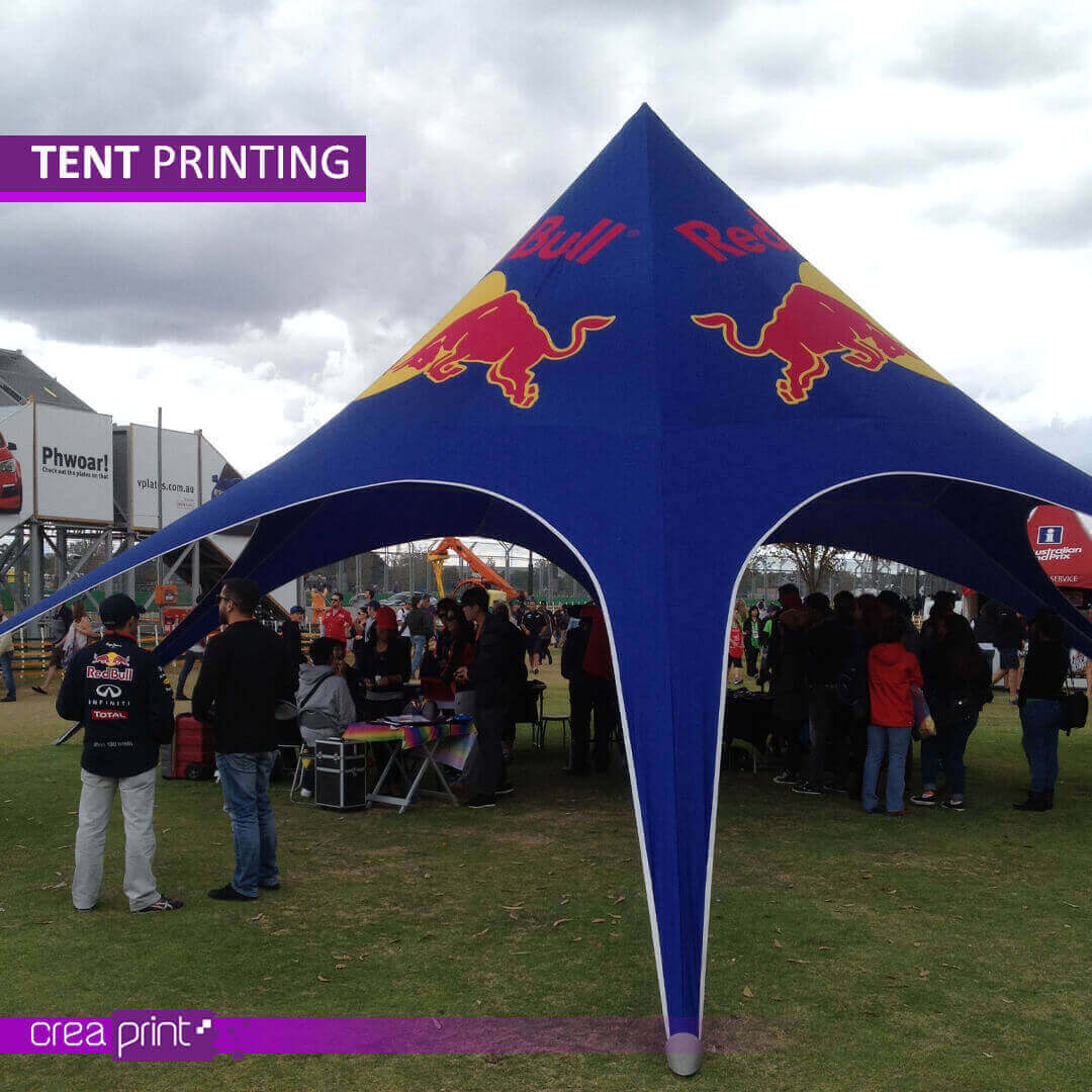 A vibrant image of a custom-printed star tent with a unique design, showcasing its eye-catching appeal at an outdoor event.