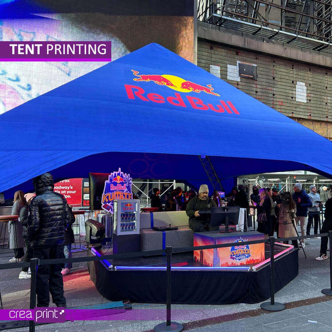 A vibrant image of a custom-printed pop-up tent with a unique design, showcasing its eye-catching appeal at a bustling outdoor event. Attendees are drawn to the vibrant colors and engaging visuals.