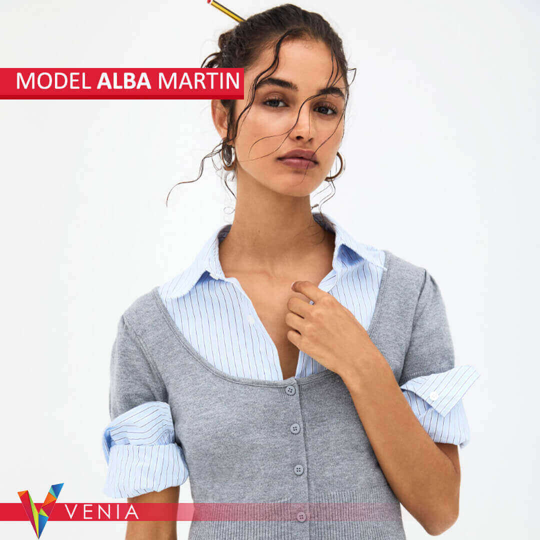 A professional model posing confidently in a stylish outfit.