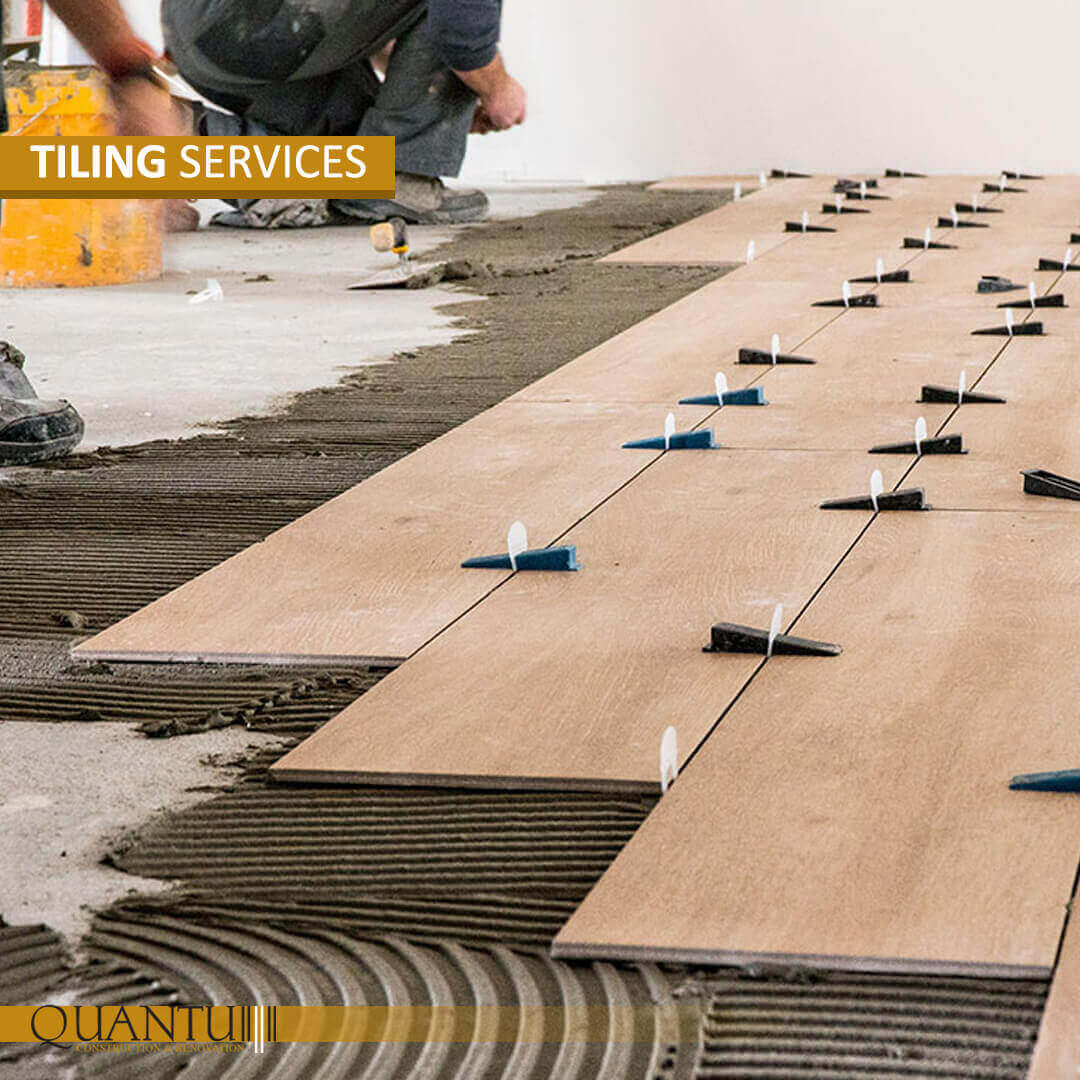 Tiling worker services by Quantum, professional tile installation.
